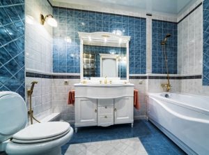 striking blue and white tile in an elegant remodeled bathroom